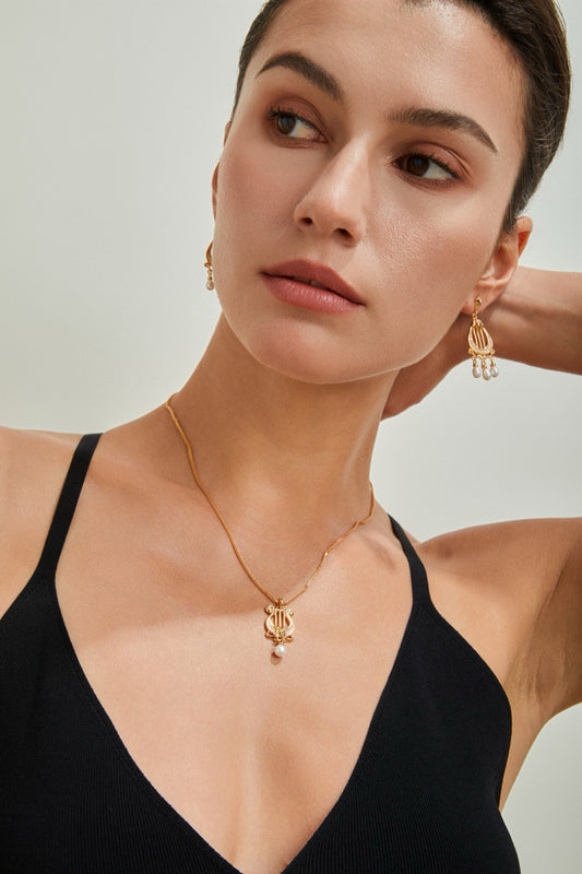 “Lyra Dreams”S925 sterling silver plated with 18k gold necklace and earrings