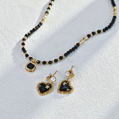 Vintage Heart Pearl Earrings — Elegant, Playful, and Timeless